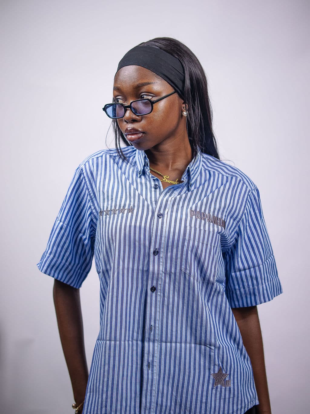 A member of the PAPANDU tribe, wearing the Signature Stripe Shirt